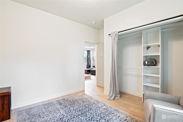 3021 Stella Rd, Longview, WA 98632 - unfurnished bedroom featuring a closet, a textured ceiling, baseboards, and light wood-type flooring