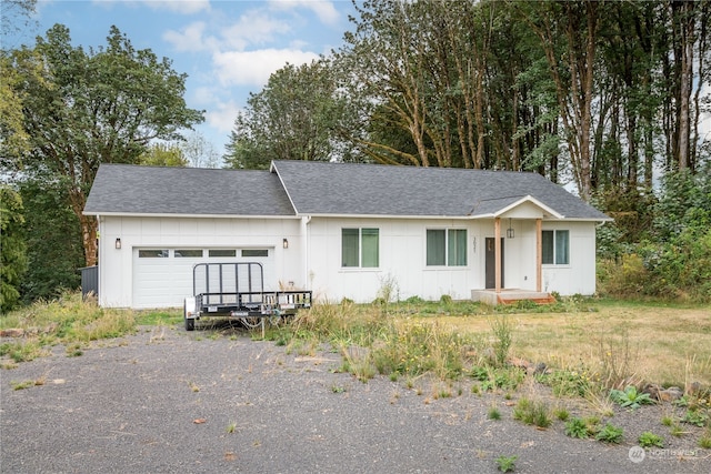 ranch-style home featuring a garage