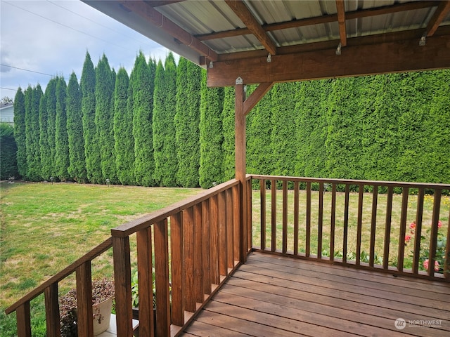 wooden deck with a yard