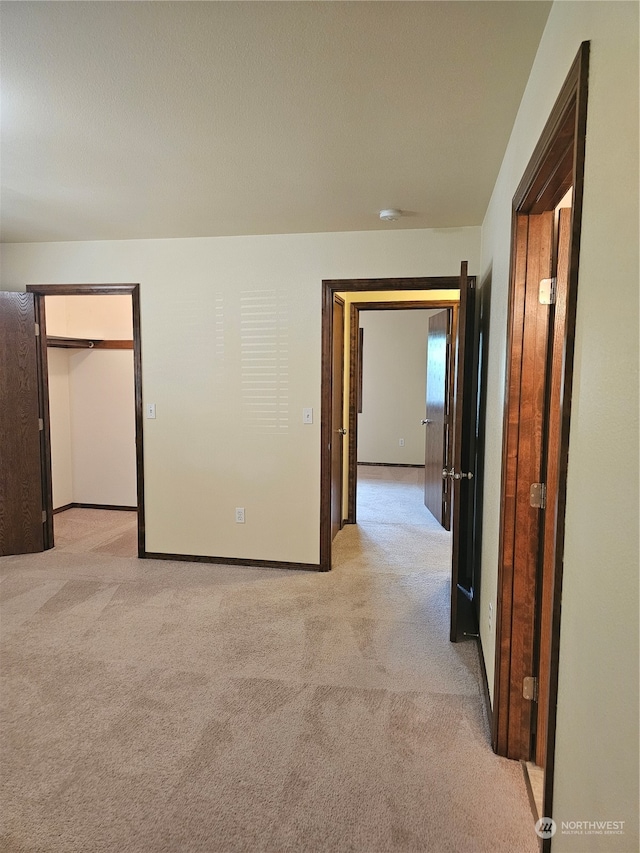 corridor with light carpet