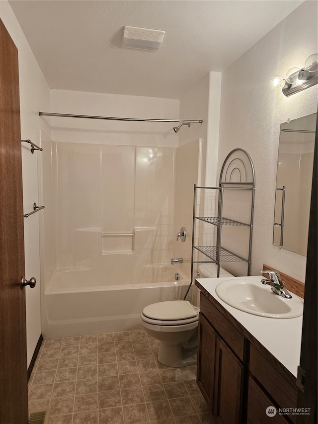 full bathroom with tile patterned floors, bathtub / shower combination, vanity, and toilet