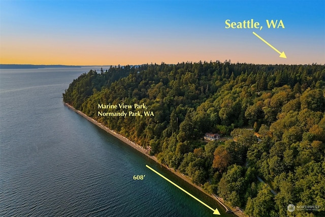 aerial view at dusk with a water view