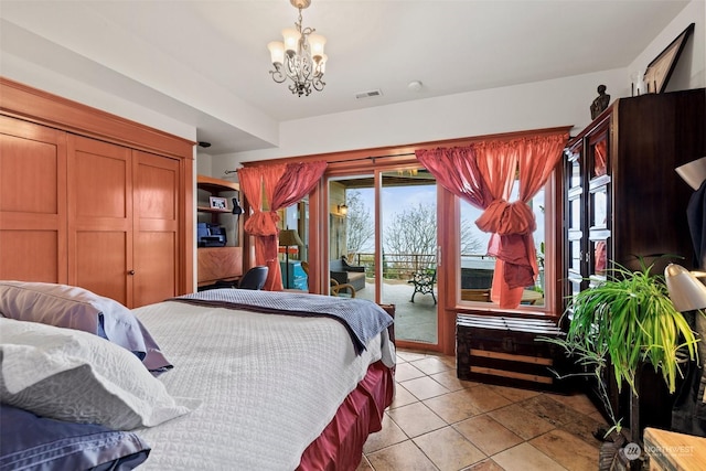 bedroom with a chandelier, access to outside, and light tile patterned floors