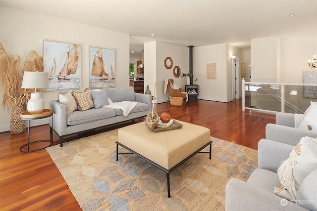 living room with hardwood / wood-style floors and a wood stove