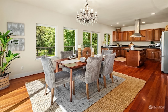 dining room featuring dark hardwood / wood-style floors and a notable chandelier