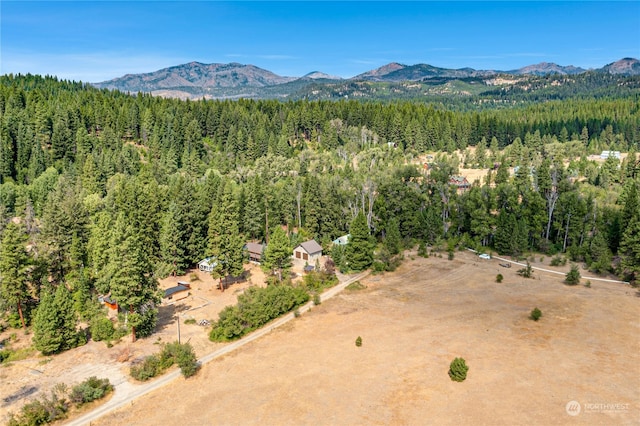 aerial view with a mountain view and a view of trees