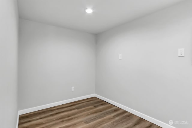 empty room with hardwood / wood-style floors