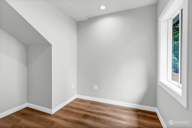 empty room with hardwood / wood-style flooring