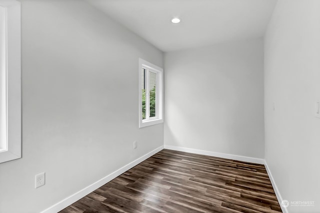 empty room featuring dark wood-type flooring