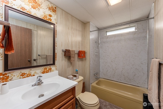 full bathroom featuring shower / washtub combination, toilet, a textured ceiling, and vanity