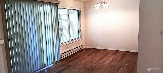 12602 NE 118th St, Kirkland, WA 98034 - empty room featuring a chandelier, a wealth of natural light, a baseboard heating unit, and dark wood finished floors