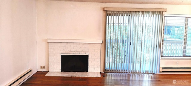 12602 NE 118th St, Kirkland, WA 98034 - details with baseboard heating, wood finished floors, and a brick fireplace
