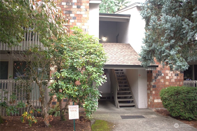 12602 NE 118th St, Kirkland, WA 98034 - exterior space featuring an attached carport and a shingled roof