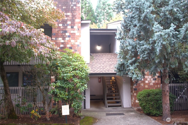 12602 NE 118th St, Kirkland, WA 98034 - view of property with an attached carport, stairs, and fence