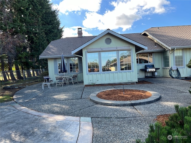 back of property featuring a patio