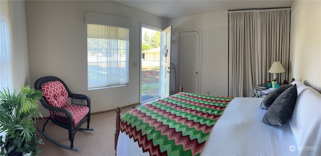 bedroom with carpet floors and access to exterior