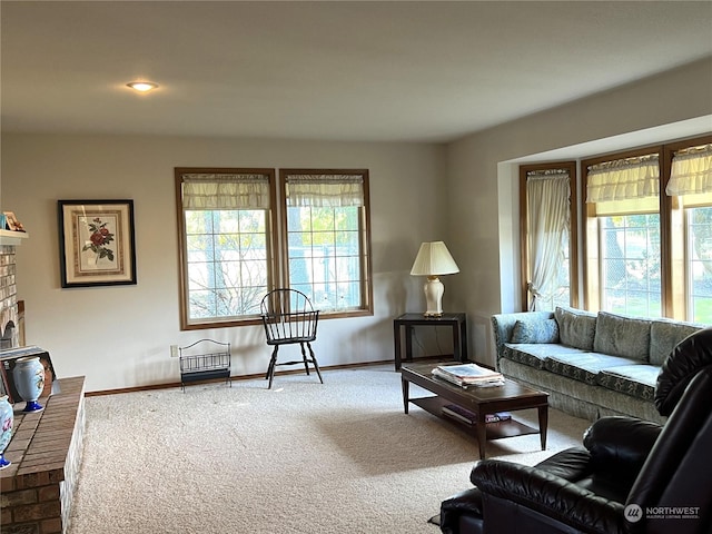 living area featuring a brick fireplace, carpet, recessed lighting, and baseboards