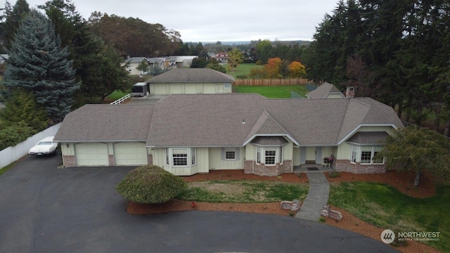 580 N Dunlap Ave, Sequim, WA 98382 - view of front of house featuring central AC, driveway, a front lawn, and an attached garage