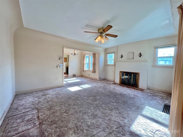 unfurnished living room featuring light carpet and ceiling fan