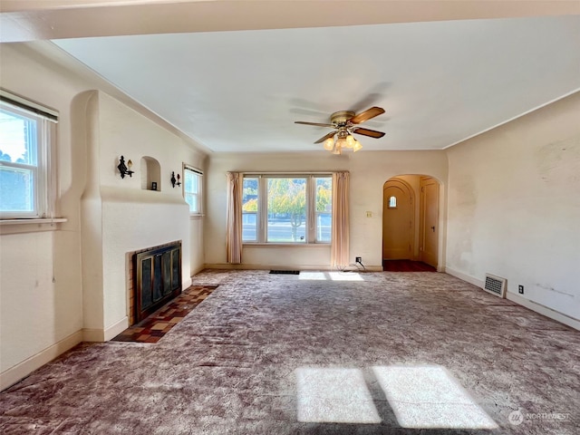 unfurnished living room with ceiling fan