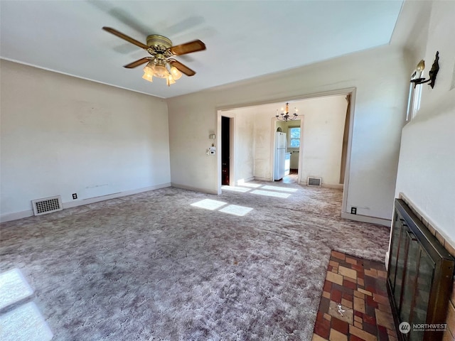 empty room with ceiling fan and carpet flooring