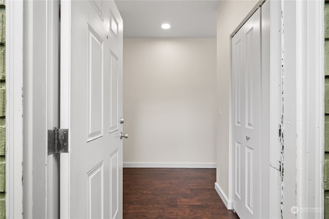 hallway with dark hardwood / wood-style floors