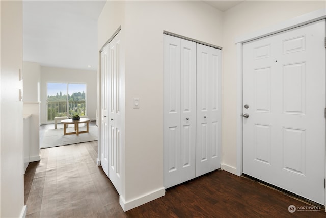 hallway with dark wood-type flooring