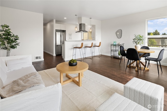 living room featuring dark hardwood / wood-style floors