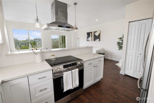 kitchen with dark hardwood / wood-style floors, stainless steel electric stove, wall chimney exhaust hood, decorative light fixtures, and white cabinets