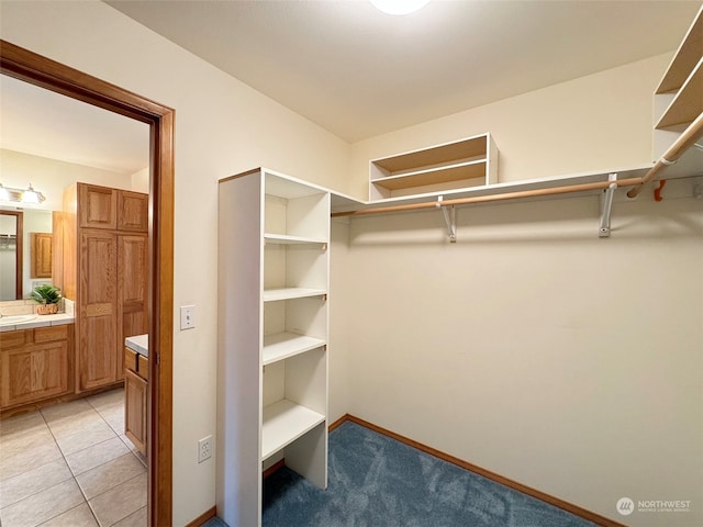 walk in closet featuring light tile patterned floors