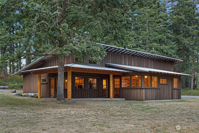 view of home's exterior with a lawn