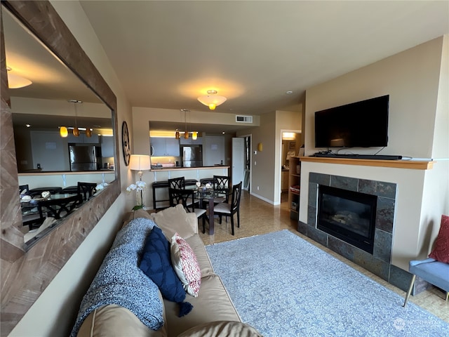 living room featuring a fireplace