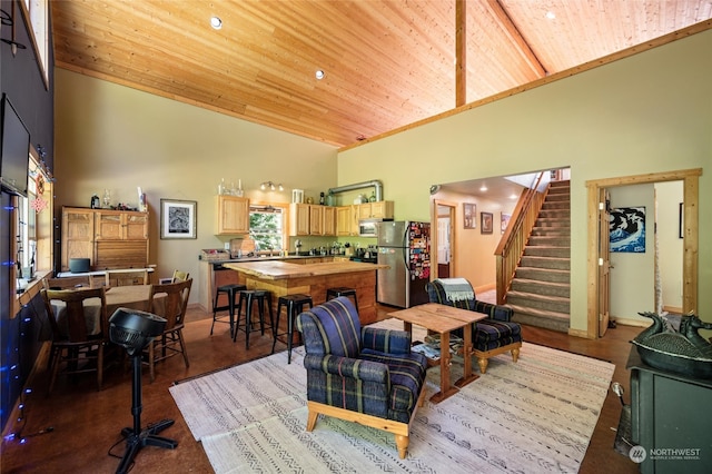 interior space with high vaulted ceiling and wooden ceiling