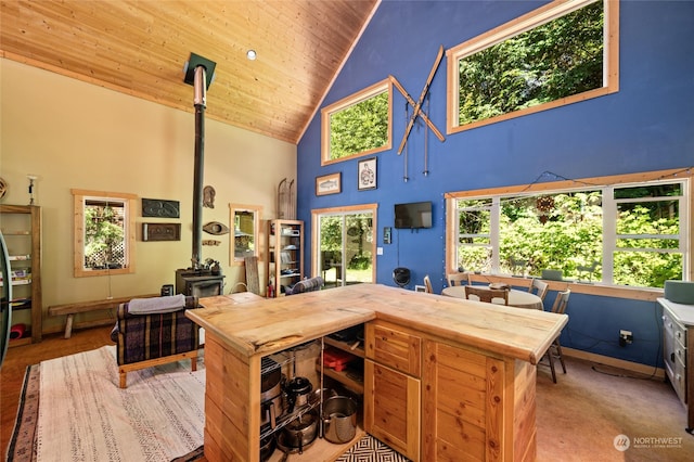 office area with wood ceiling, plenty of natural light, and high vaulted ceiling