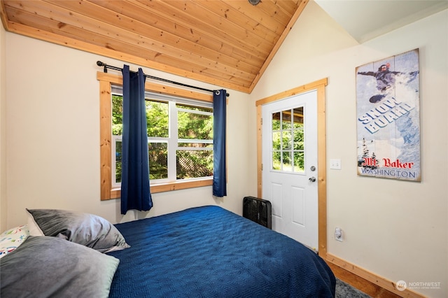 bedroom featuring multiple windows, vaulted ceiling, and wood ceiling