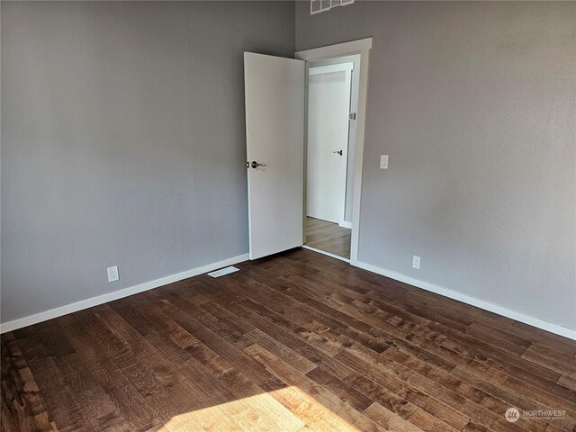 empty room with wood-type flooring