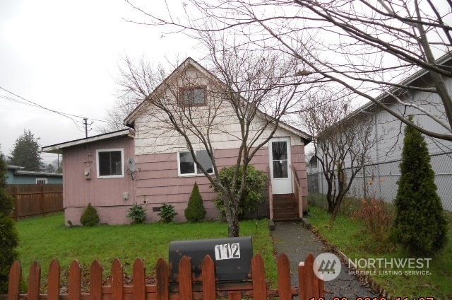 view of property exterior with a yard