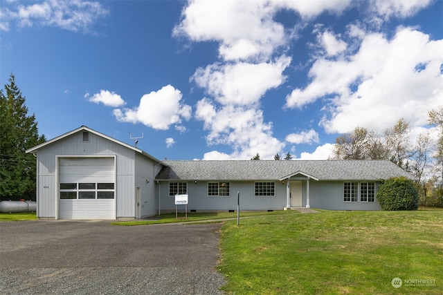 single story home with a garage and a front lawn