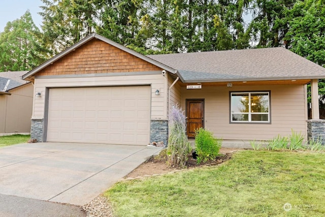 ranch-style home with a garage and a front yard