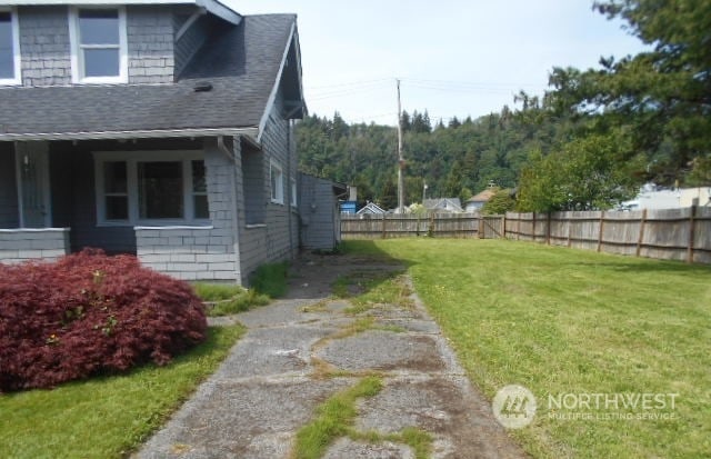 view of home's exterior featuring a yard