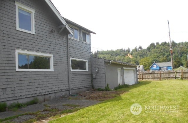 view of yard featuring a garage