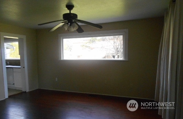 empty room featuring hardwood / wood-style floors, ceiling fan, and plenty of natural light