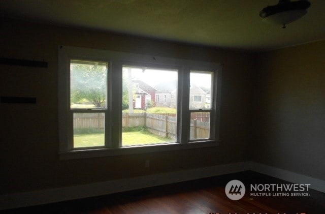 spare room featuring hardwood / wood-style floors