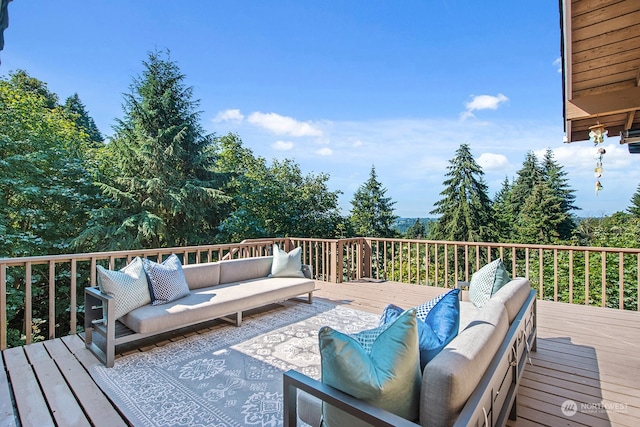 wooden deck featuring an outdoor hangout area