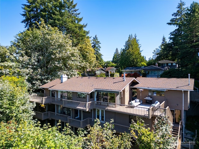 rear view of house with a balcony