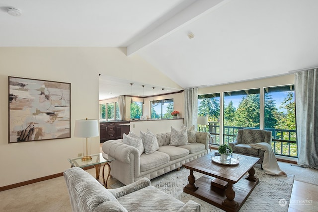 carpeted living room featuring high vaulted ceiling, a wealth of natural light, and beamed ceiling