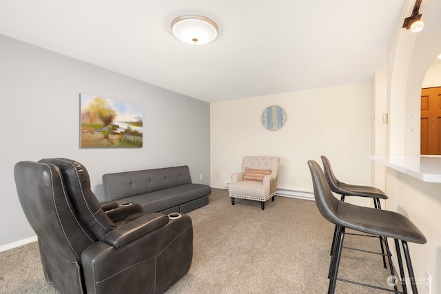 living room with carpet floors and baseboard heating