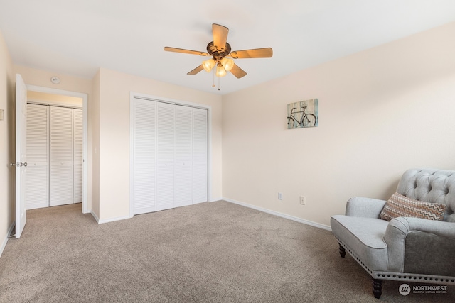 unfurnished room with ceiling fan and light carpet