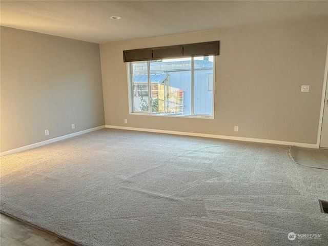 unfurnished room featuring carpet