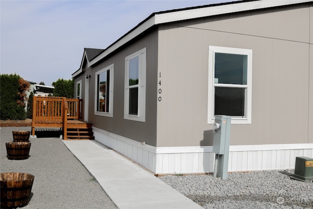 view of home's exterior with a deck